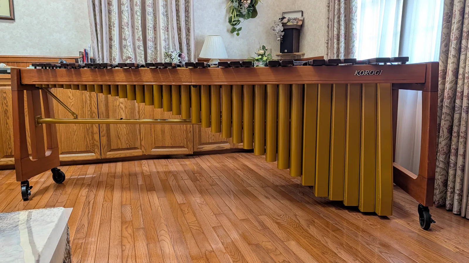 Back of a concert marimba showing numbered resonators of different lengths beneath the bars
